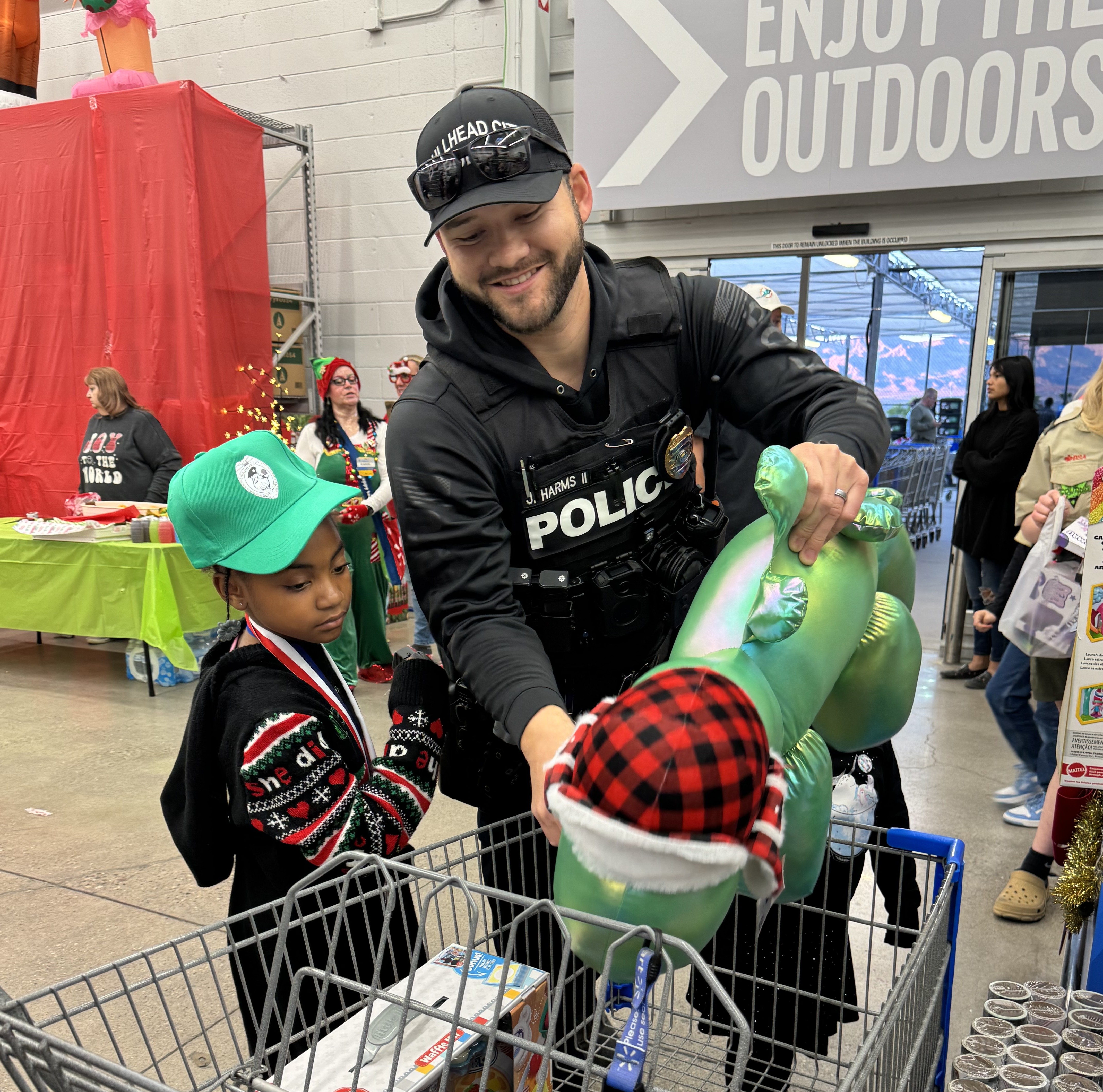 girl with officer shopping for Christmas