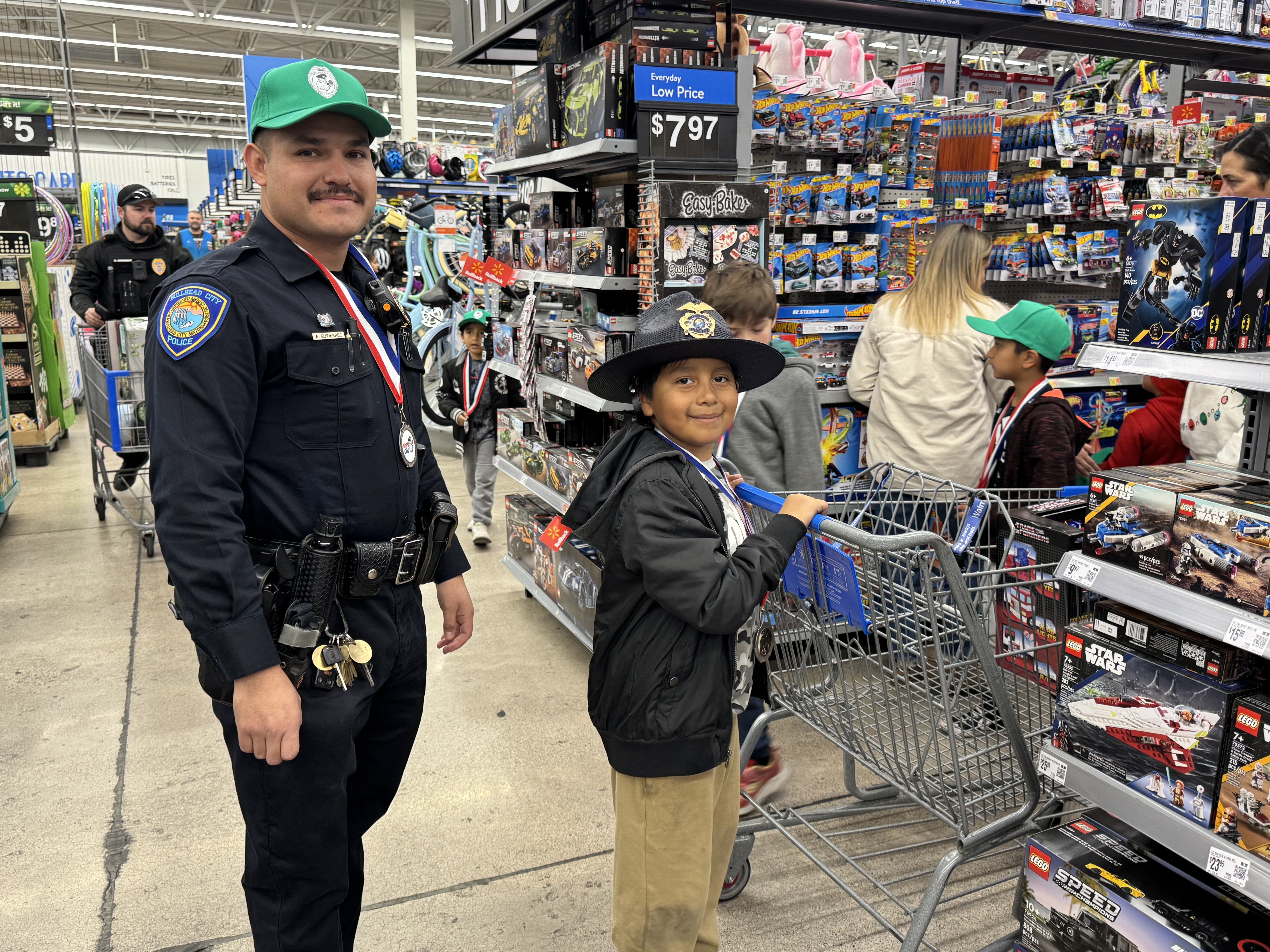 boy with officer shopping for Christmas