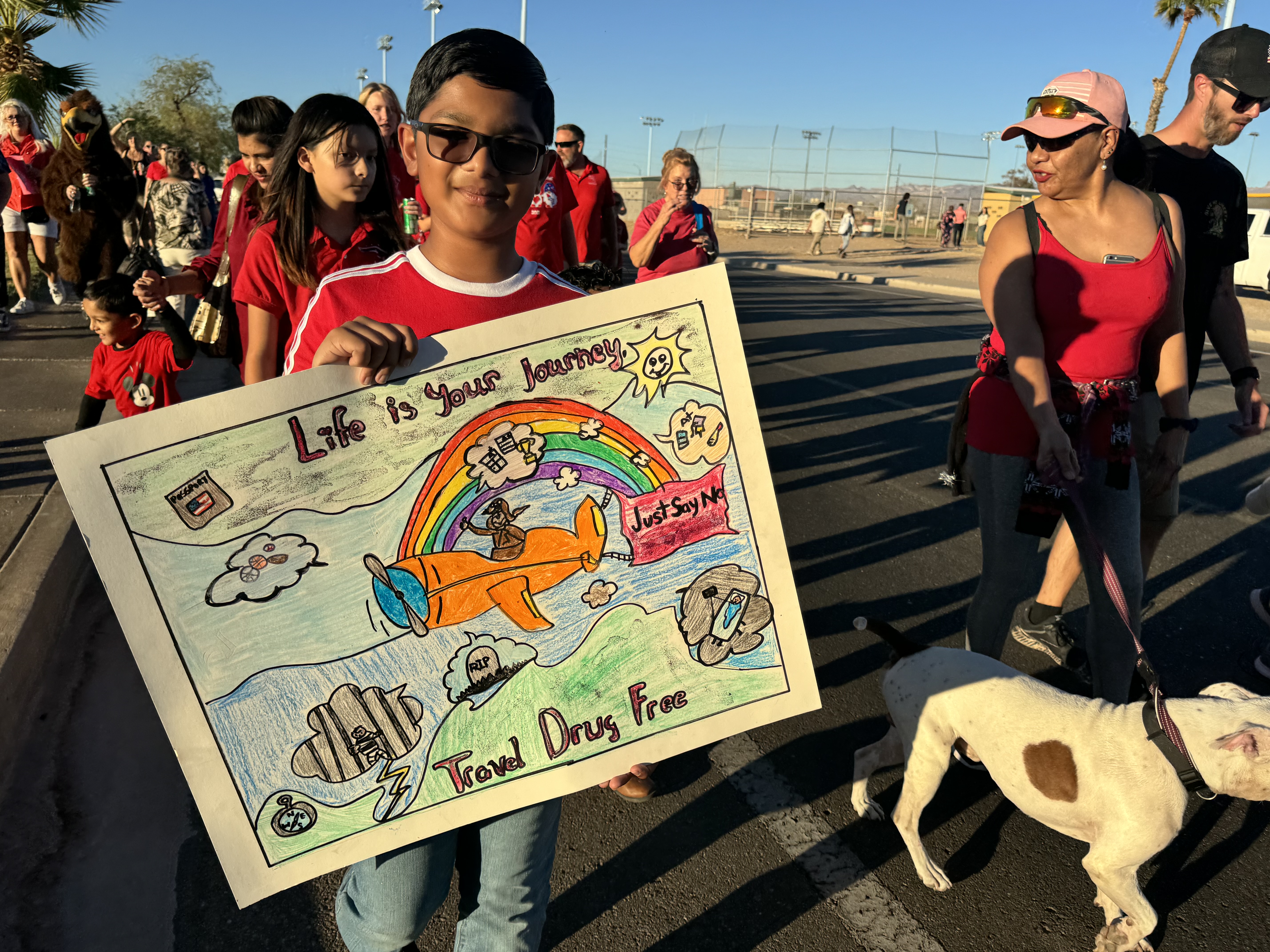 Boy with anti drug poster