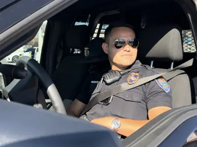 officer in his patrol vehicle 