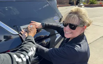 person vin etching a car window