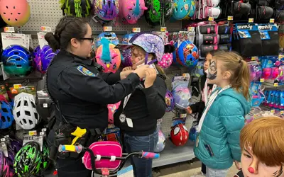 girl with officer shopping for Christmas