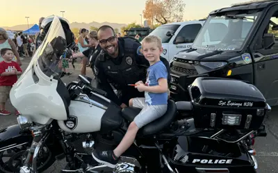 boy sitting on a police motorcycle
