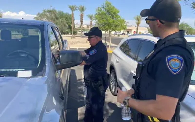 police officers pictured next to a car