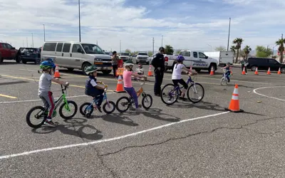 police giving instructions to bicycle riders. 