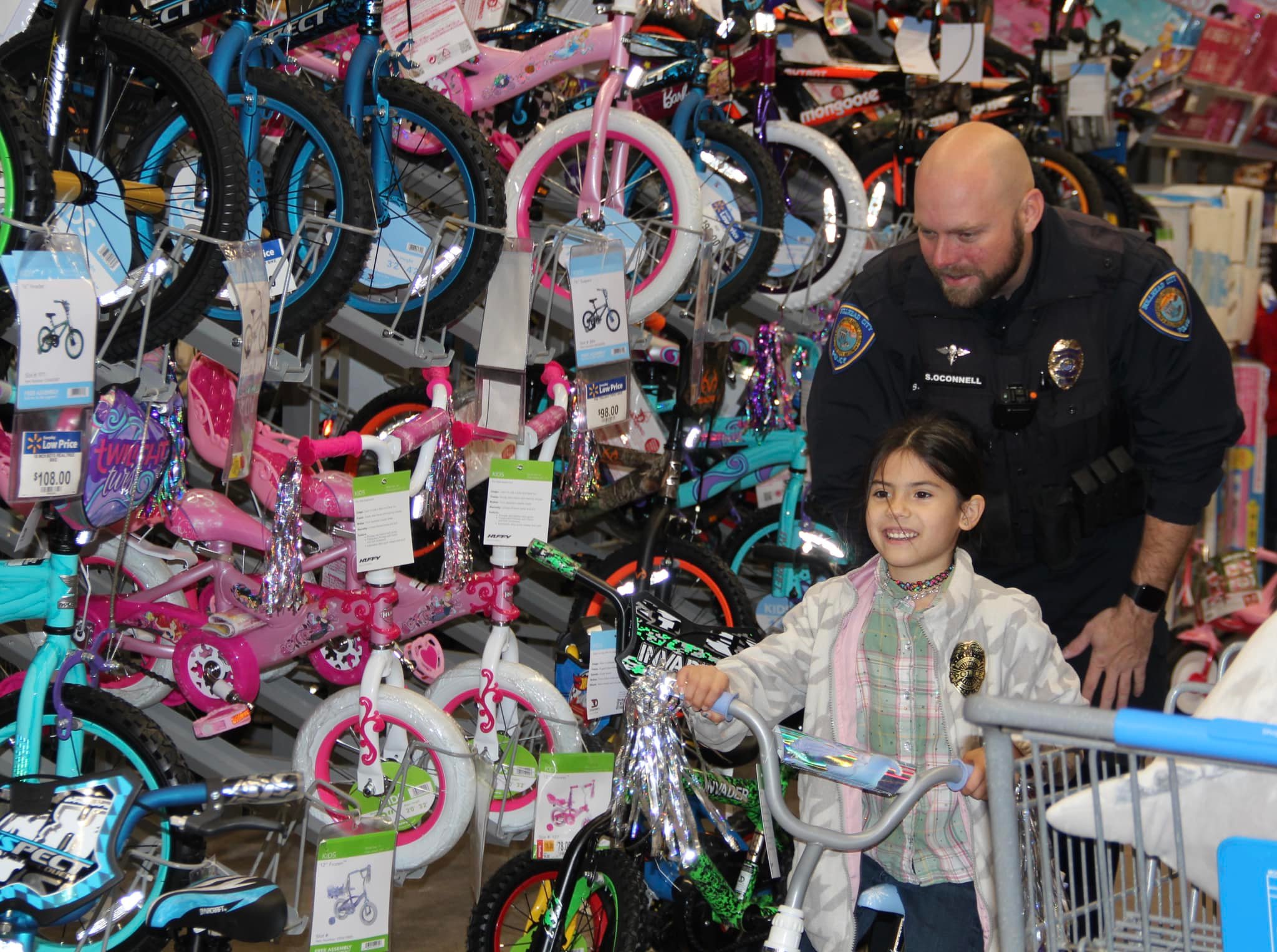 girl with officer shopping for Christmas