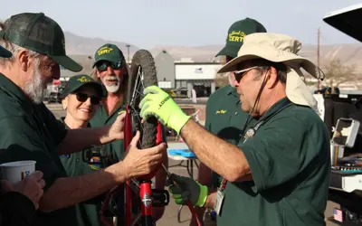 volunteers fixing a bicycle