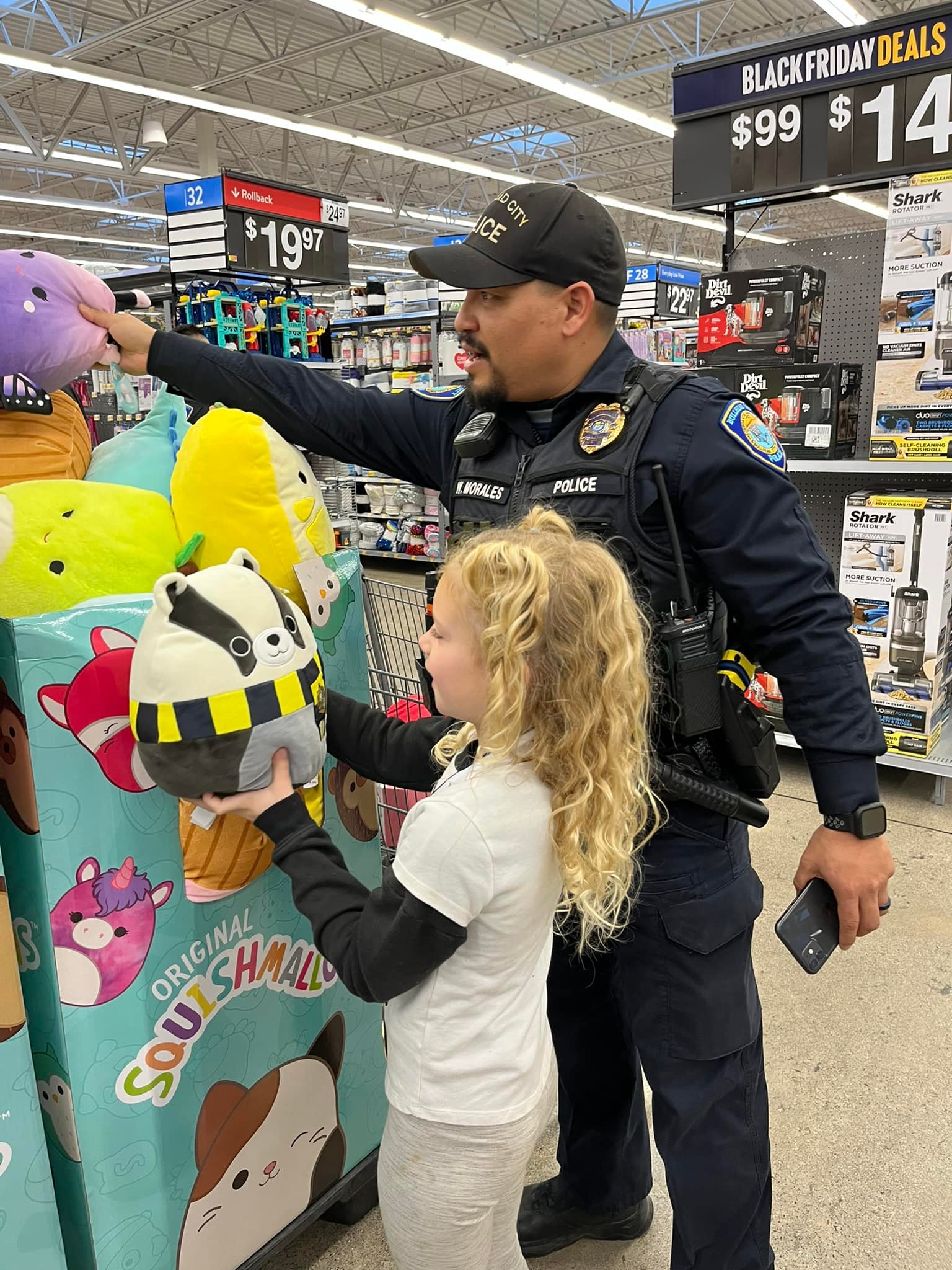 girl with officer shopping for Christmas